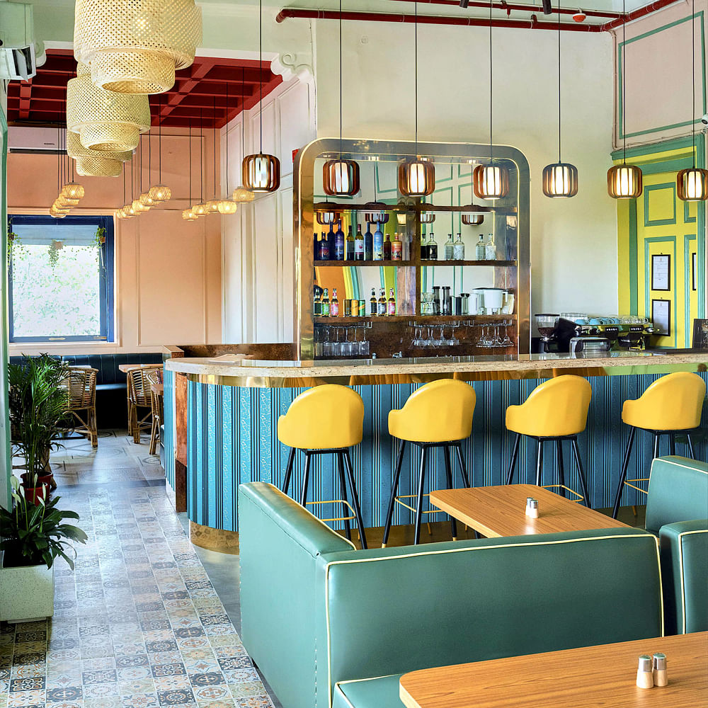 Furniture,Interior design,Table,Chair,Restaurant,Light fixture,Wood stain,Chandelier,Ceiling,Kitchen & Dining Room Table