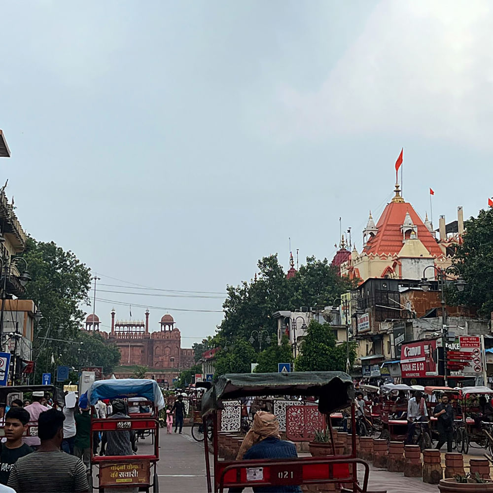 Sky,Mode of transport,Motor vehicle,Town,Public space,Street,Pedestrian,Motorcycle,Traffic,Travel