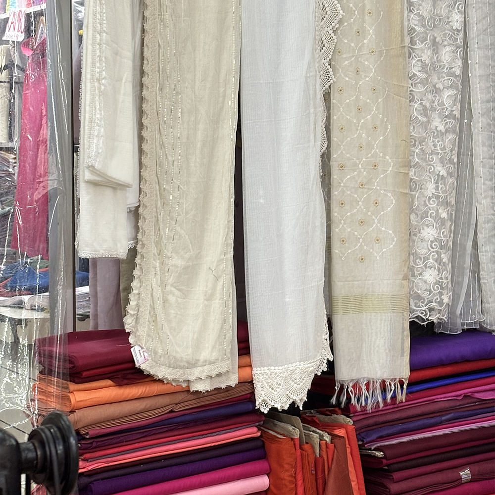 Textile,Pink,Linens,Retail,Curtain,Shawl,Natural material,Woven fabric,Boutique,Stole