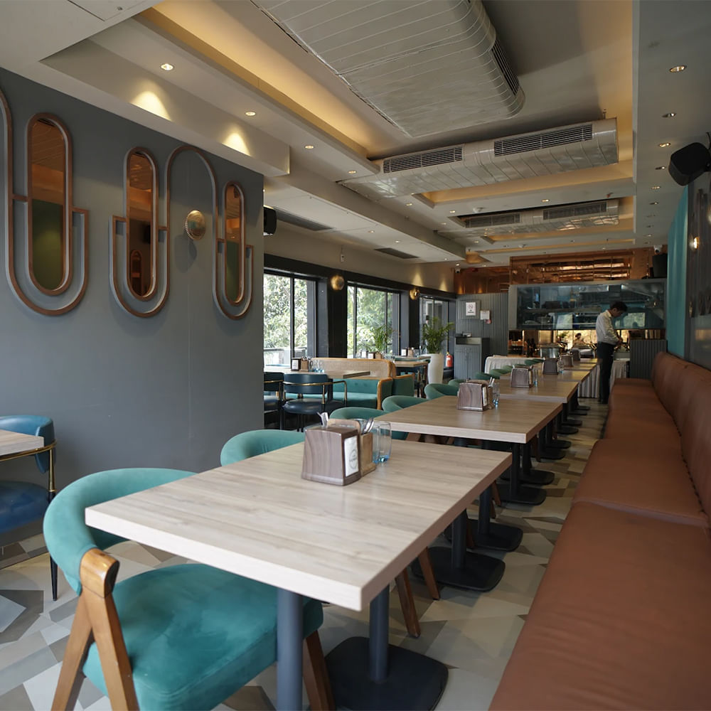 Interior design,Restaurant,Ceiling,Cafeteria,Kitchen & Dining Room Table,Chair,Light fixture,Coffee table,Varnish,Hotel