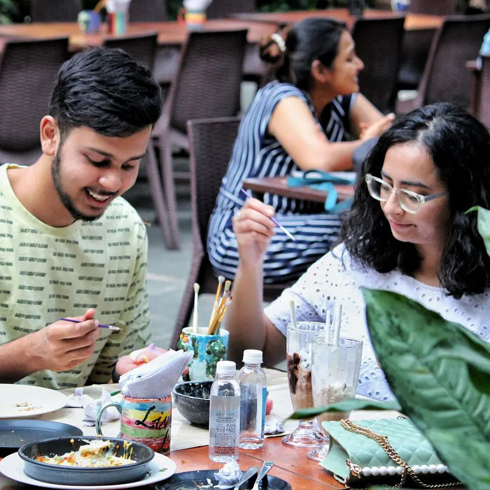 Tableware,Furniture,Shirt,Table,Food,Drinkware,Restaurant,Plate,Sharing,Dishware