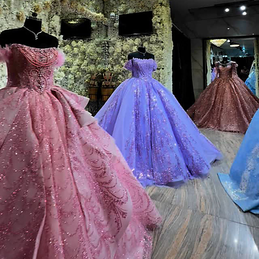 Formal wear,Gown,Dress,Textile,Fashion,Pink,Bridal Clothing,Purple,Haute couture,Fashion design