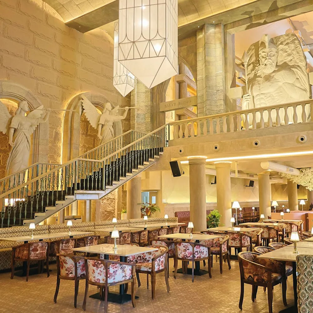 Interior design,Furniture,Ceiling,Lighting,Light fixture,Flooring,Chair,Restaurant,Table,Floor