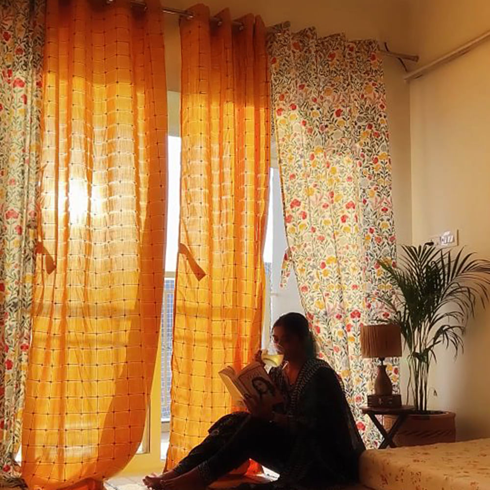 Yellow,Interior design,Window covering,Orange,Curtain,Textile,Window treatment,Room,Living room,Design