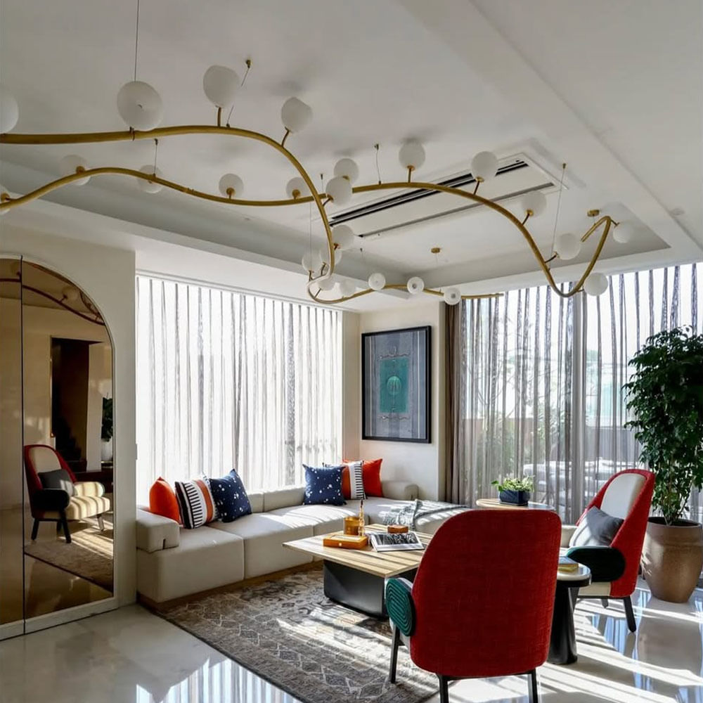 Furniture,Interior design,Wall,Light fixture,Flooring,Ceiling,Lighting,Floor,Table,Room