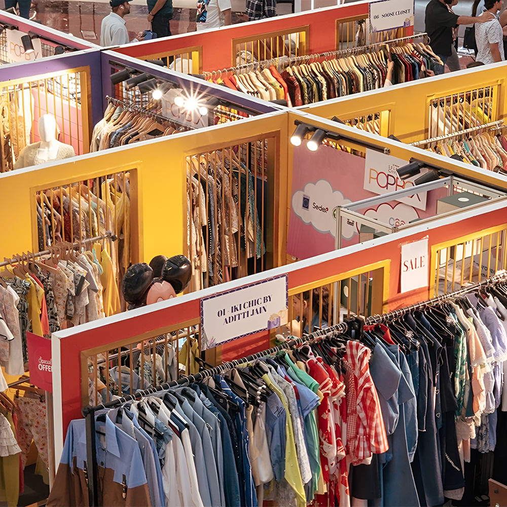 Retail,Interior design,Textile,Ceiling,Customer,Boutique,Shopping mall,Outlet store,Clothes hanger,Collection