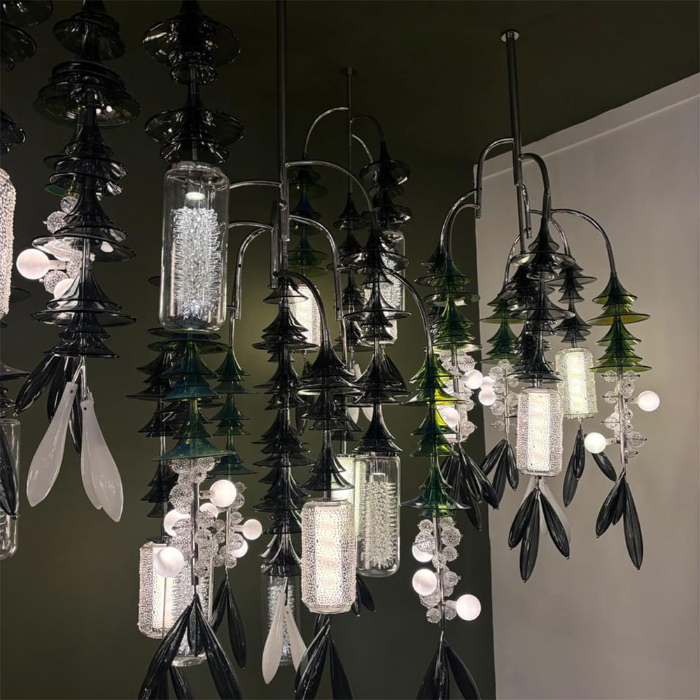 Chandelier,Glass,Light fixture,Natural material,Silver,Design,Still life photography