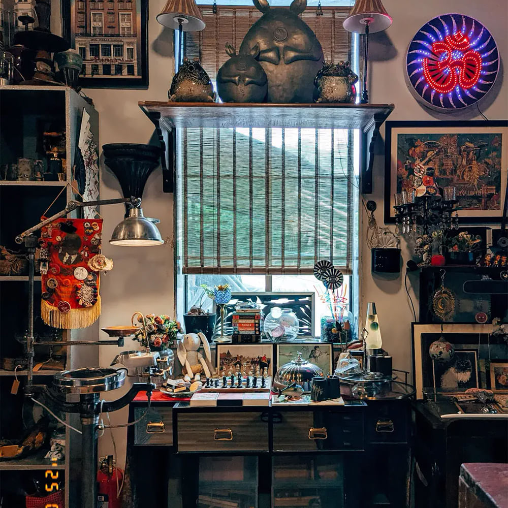 Interior design,Lighting,Light fixture,Picture frame,Shelf,Lamp,Antique,Collection,Shelving,Collectable