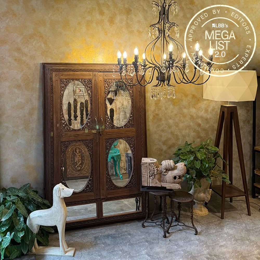 Interior design,Furniture,Light fixture,Lighting,Chandelier,Picture frame,Antique,Room,Natural material,Lamp