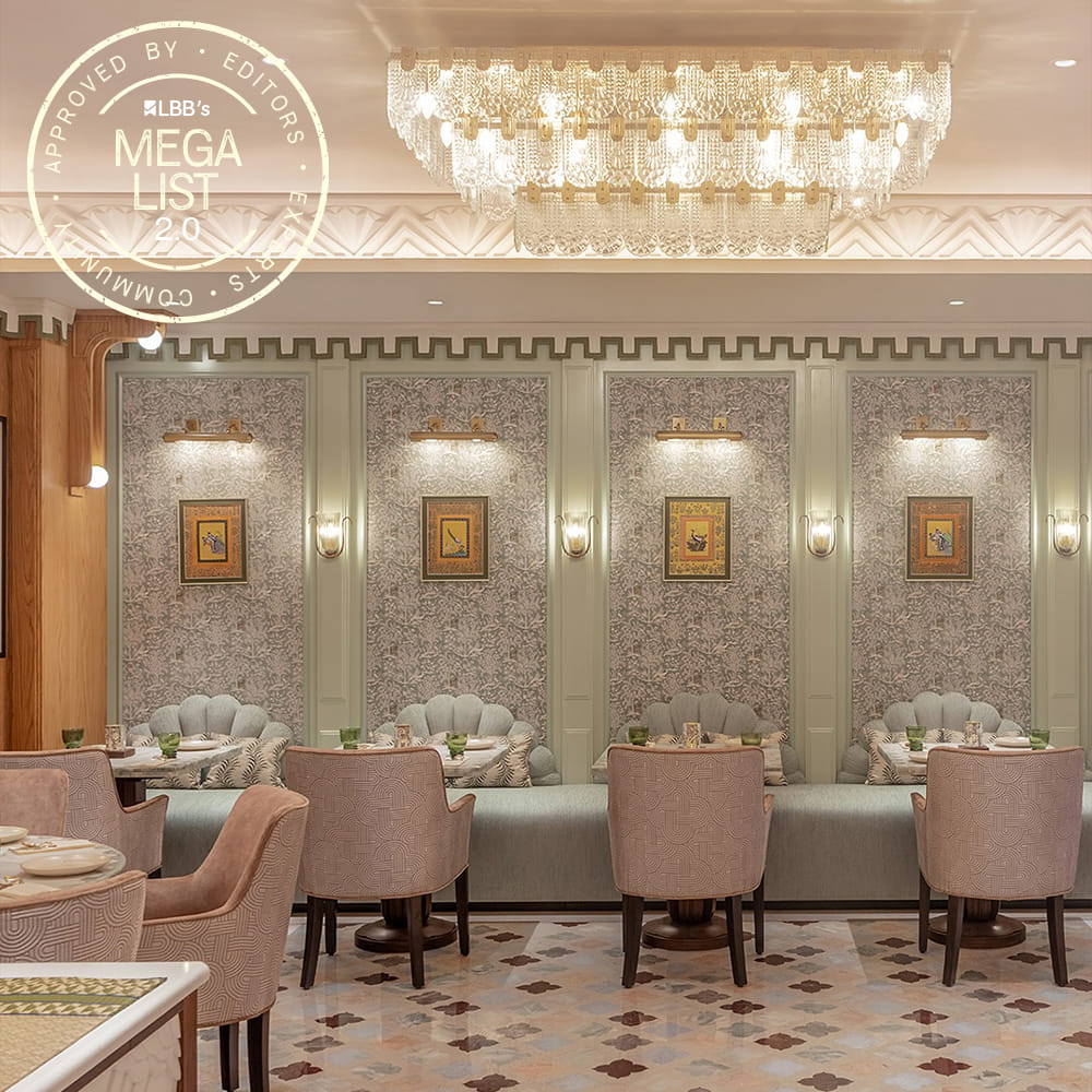 Furniture,Interior design,Table,Chandelier,Ceiling,Chair,Light fixture,Living room,Room,Restaurant