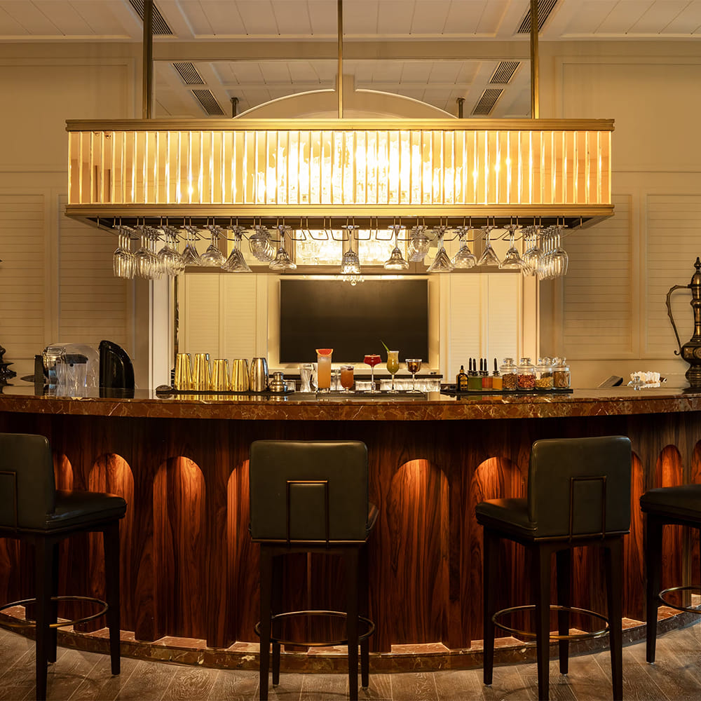 Interior design,Lighting,Furniture,Light fixture,Ceiling,Bar,Bar stool,Restaurant,Wood stain,Countertop