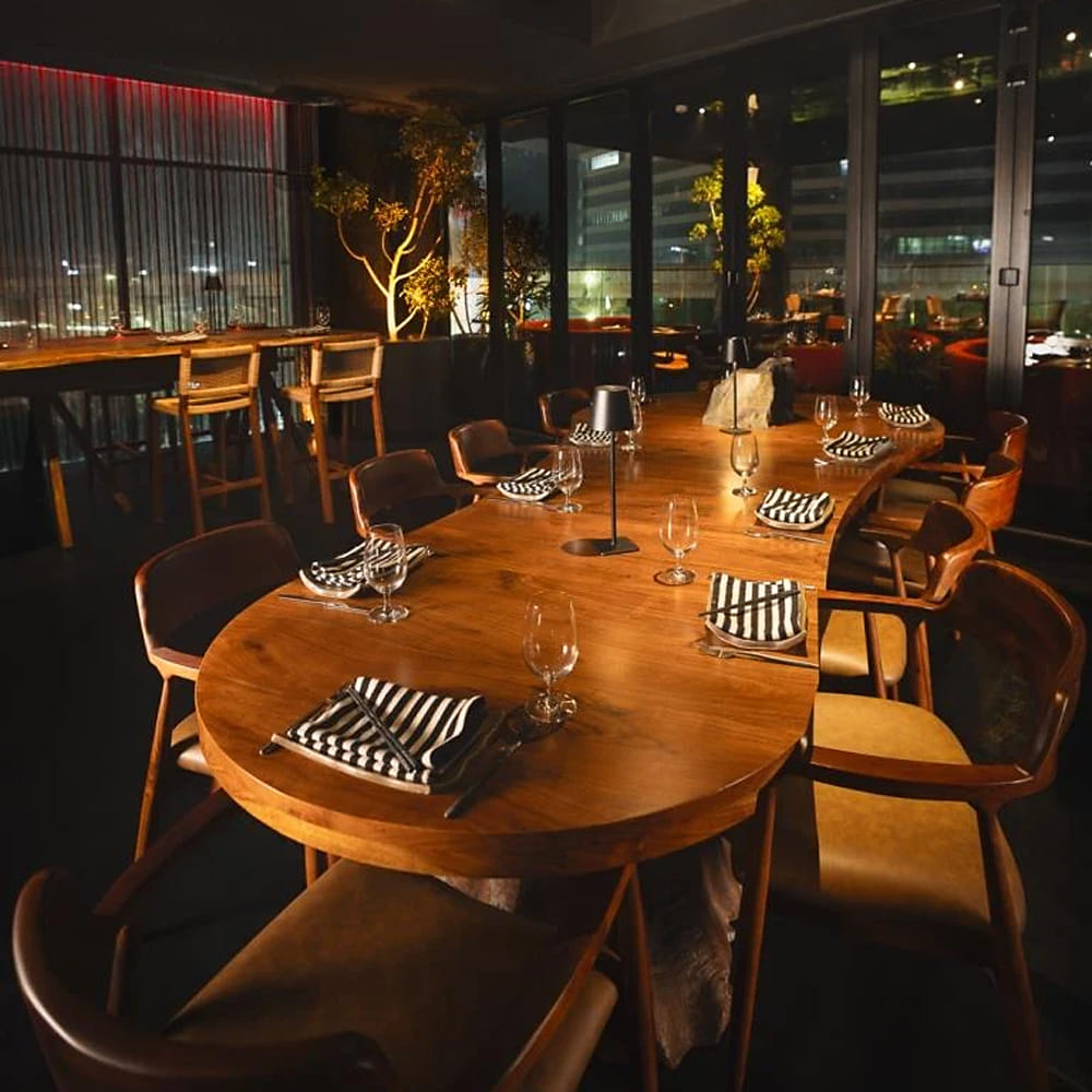 Furniture,Interior design,Restaurant,Lighting,Chair,Kitchen & Dining Room Table,Ceiling,Light fixture,Barware,Wood stain